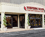 WHISPERING WOODS HOTEL & CONFERENCE CENTER